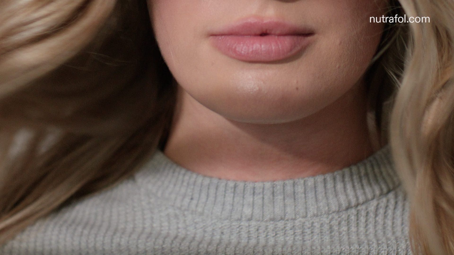 RIOT, NYC Creative Agency: Close-up of a woman’s lips and hair, symbolizing natural beauty and confidence. Close-up of a woman’s lips and hair, symbolizing natural beauty and confidence.
