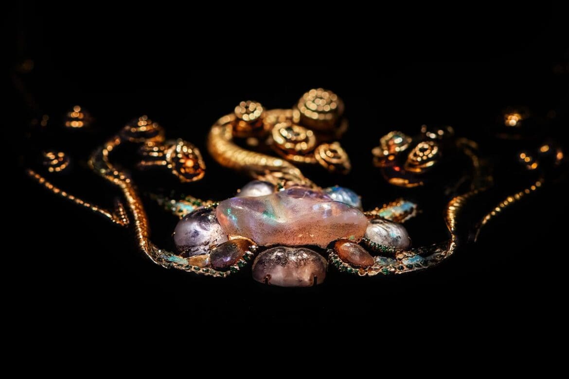 Exquisite Louis Comfort Tiffany Medusa pendant featuring iridescent opals and intricate gold filigree work.
