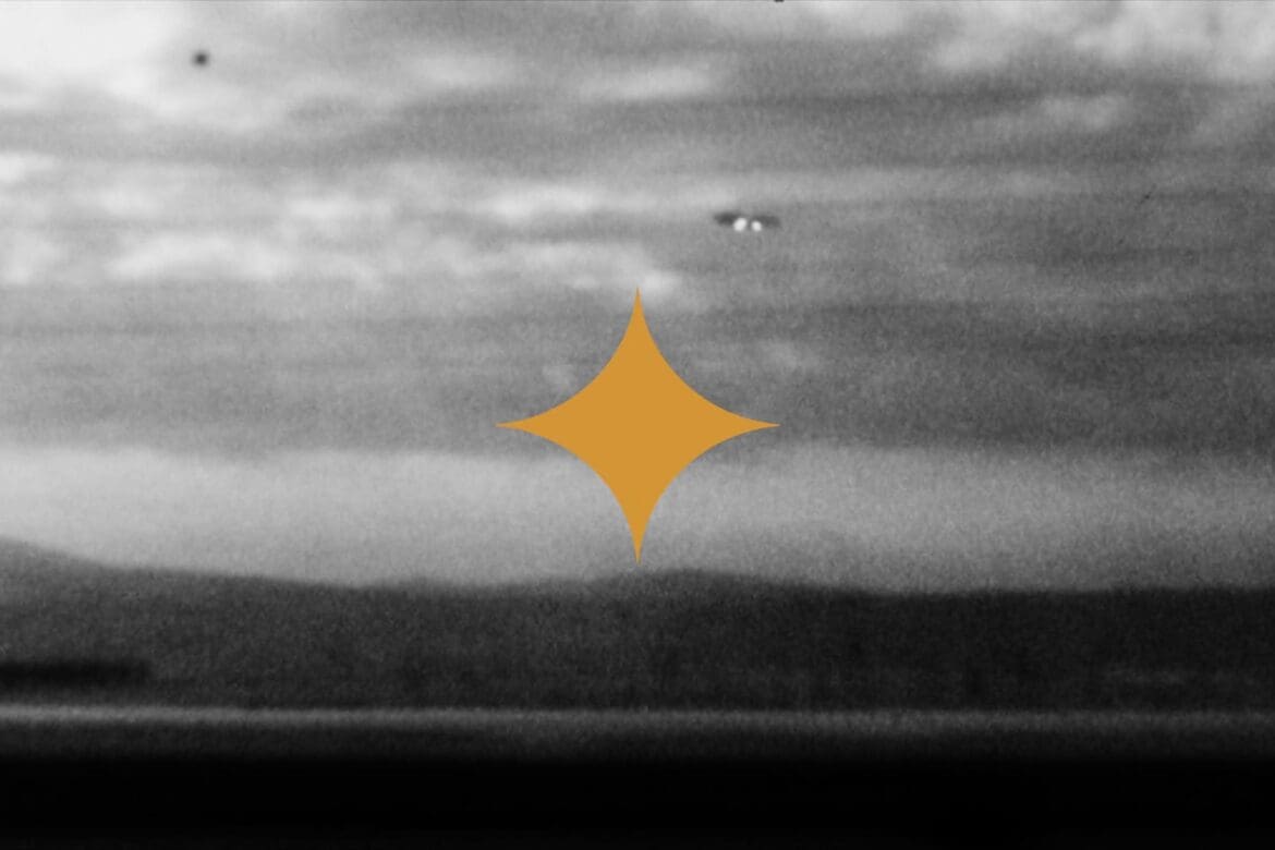 Black and white UFO sighting with a golden star overlay