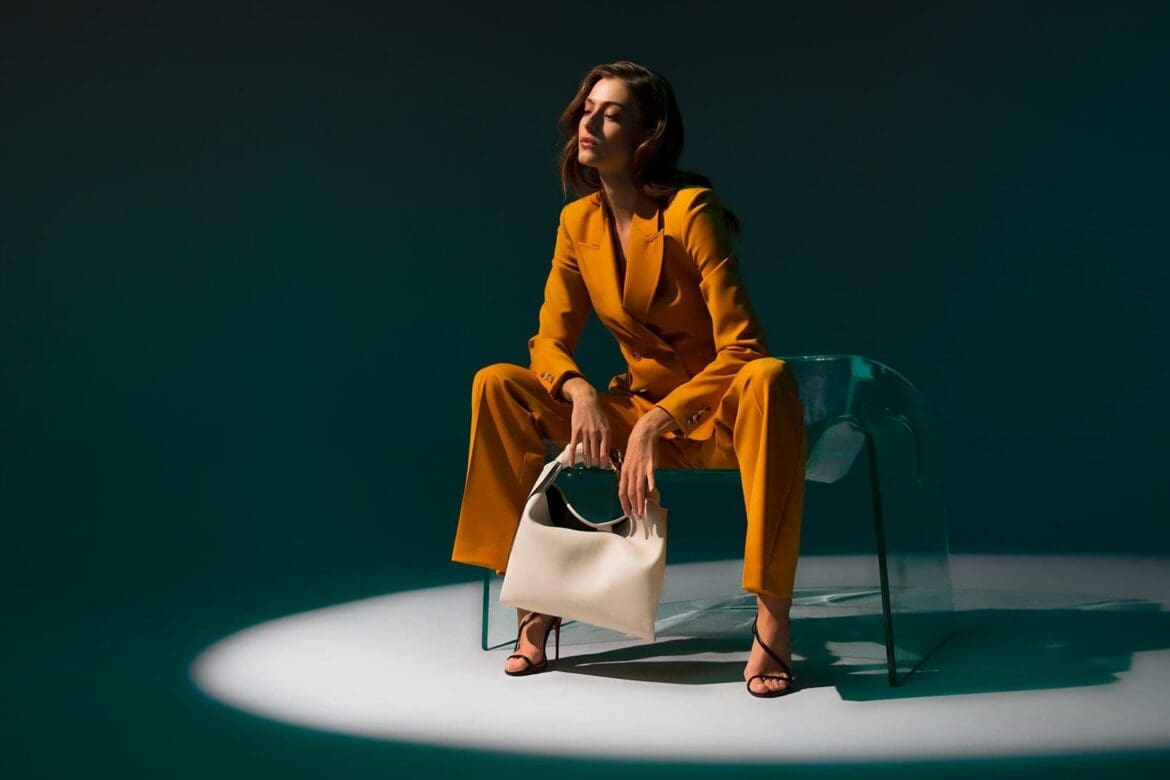 Neiman Marcus Mustard Power Suit - Sitting On Ghost Chair by Fiam Italia