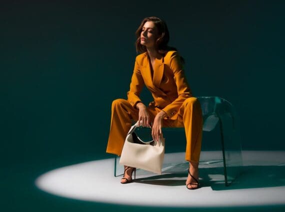 Neiman Marcus Mustard Power Suit - Sitting On Ghost Chair by Fiam Italia