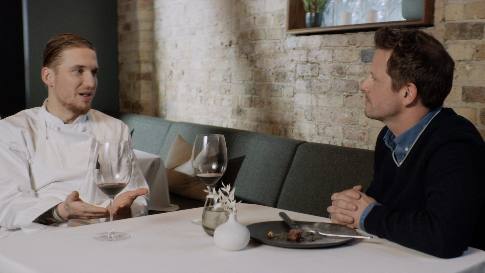 Chef Noah Sandoval and Jamie McDonald discussing the connection between futures trading and fine dining at Oriole restaurant in Chicago.
