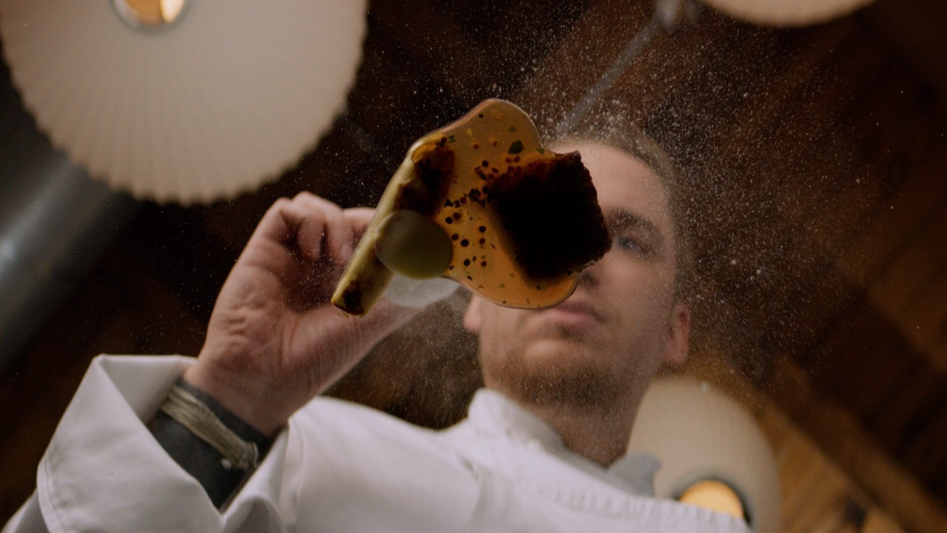 Chef Noah Sandoval carefully plating a dish at Oriole, highlighting the parallels between fine dining and futures trading.