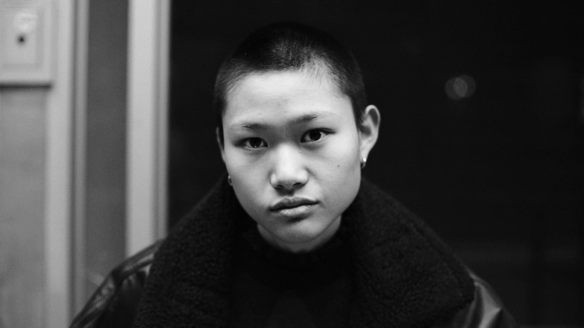 RIOT, NYC Creative Agency: A powerful black-and-white portrait of a young individual captured during the filming of RIOT’s “The Future Is Unwritten,” showcasing resilience and hope. A powerful black-and-white portrait of a young individual captured during the filming of RIOT’s “The Future Is Unwritten,” showcasing resilience and hope.