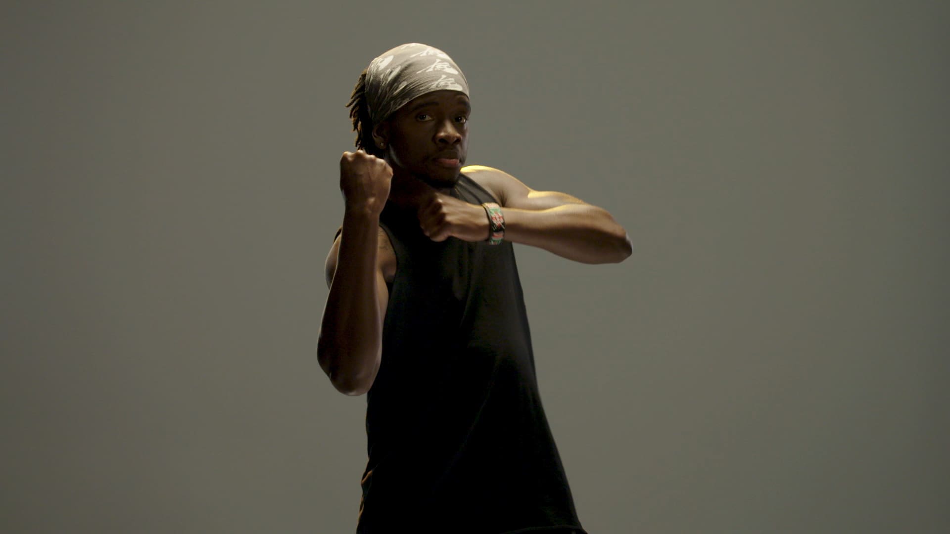 Trammell, a SoulCycle instructor, posing in a boxing stance during a SoulCycle docufilm shoot