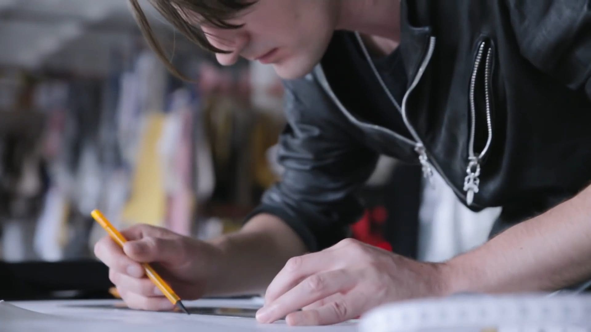 RIOT, NYC Creative Agency: Gareth Pugh sketching designs in his studio as part of his collaboration with Sunglass Hut for London Fashion Week. Gareth Pugh sketching designs in his studio as part of his collaboration with Sunglass Hut for London Fashion Week.