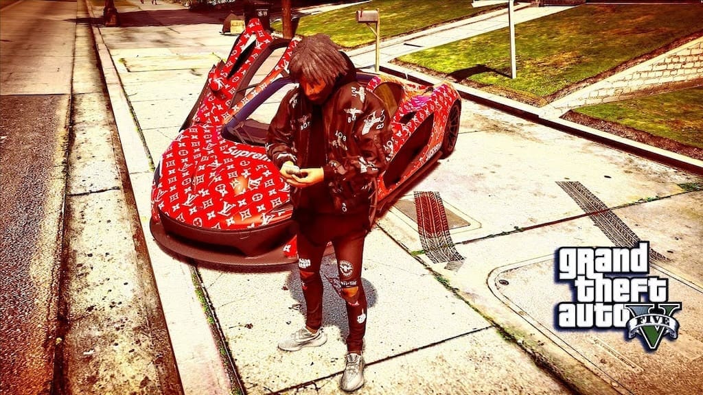 A character from Grand Theft Auto V dressed in Supreme and Louis Vuitton-inspired streetwear stands in front of a car wrapped in matching designer logos. The image reflects the game's impact on street fashion and urban culture, blending gaming visuals with real-world fashion trends.