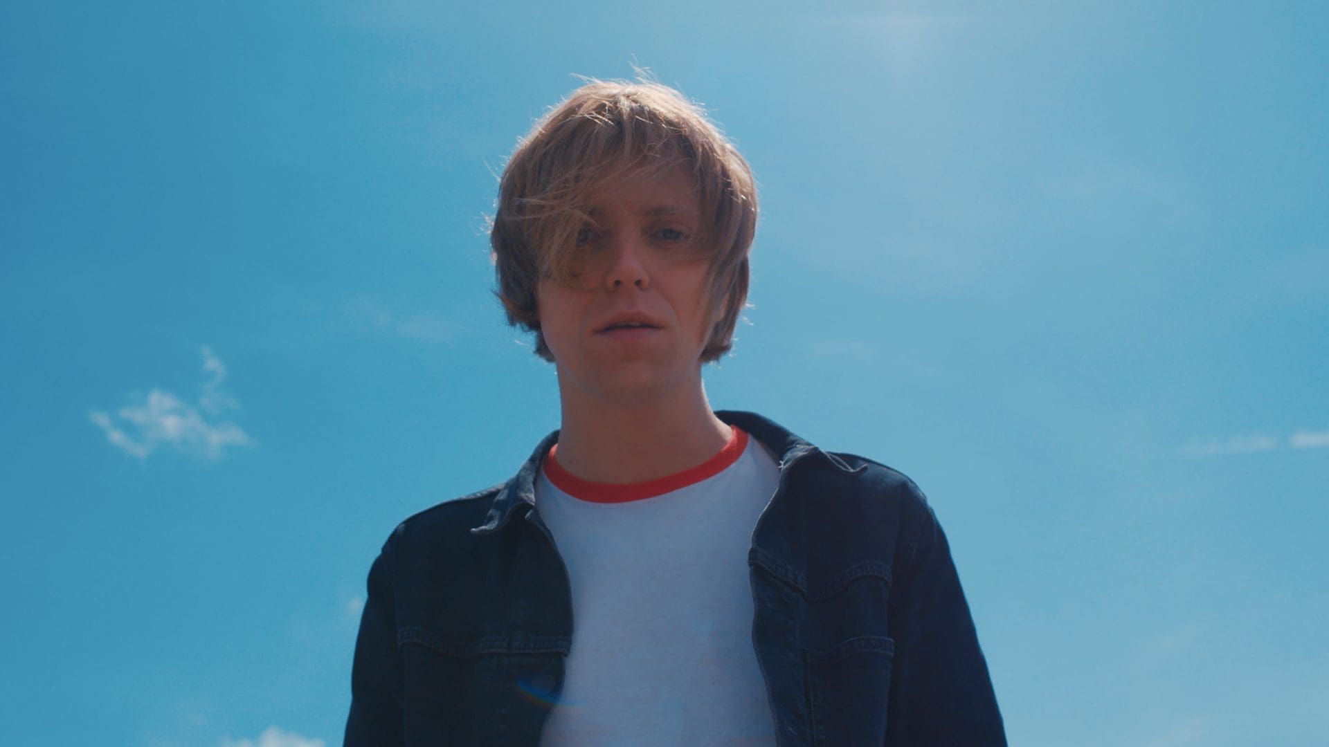 RIOT, NYC Creative Agency: Murray Macleod of The Xcerts gazing into the camera under a clear blue sky during the Hold On To Your Heart music video shoot. Murray Macleod of The Xcerts gazing into the camera under a clear blue sky during the Hold On To Your Heart music video shoot.