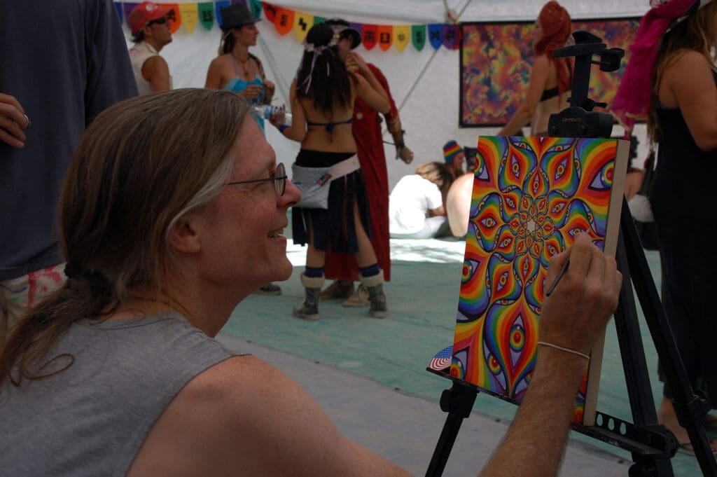RIOT, NYC Creative Agency: Alex Grey painting live at a festival, with visionary artwork in progress. Alex Grey painting live at a festival, with visionary artwork in progress.
