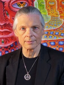 RIOT, NYC Creative Agency: Alex Grey art portrait with his visionary artwork in the background. Alex Grey art portrait with his visionary artwork in the background.