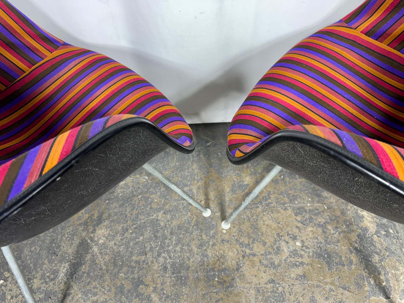 Rare Alexander Girard fabric on a Herman Miller Eames black fiberglass arm shell chair