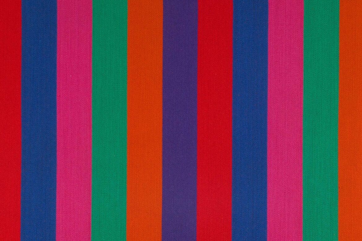 Vibrant striped fabric design by Alexander Girard called Jacob’s Coat