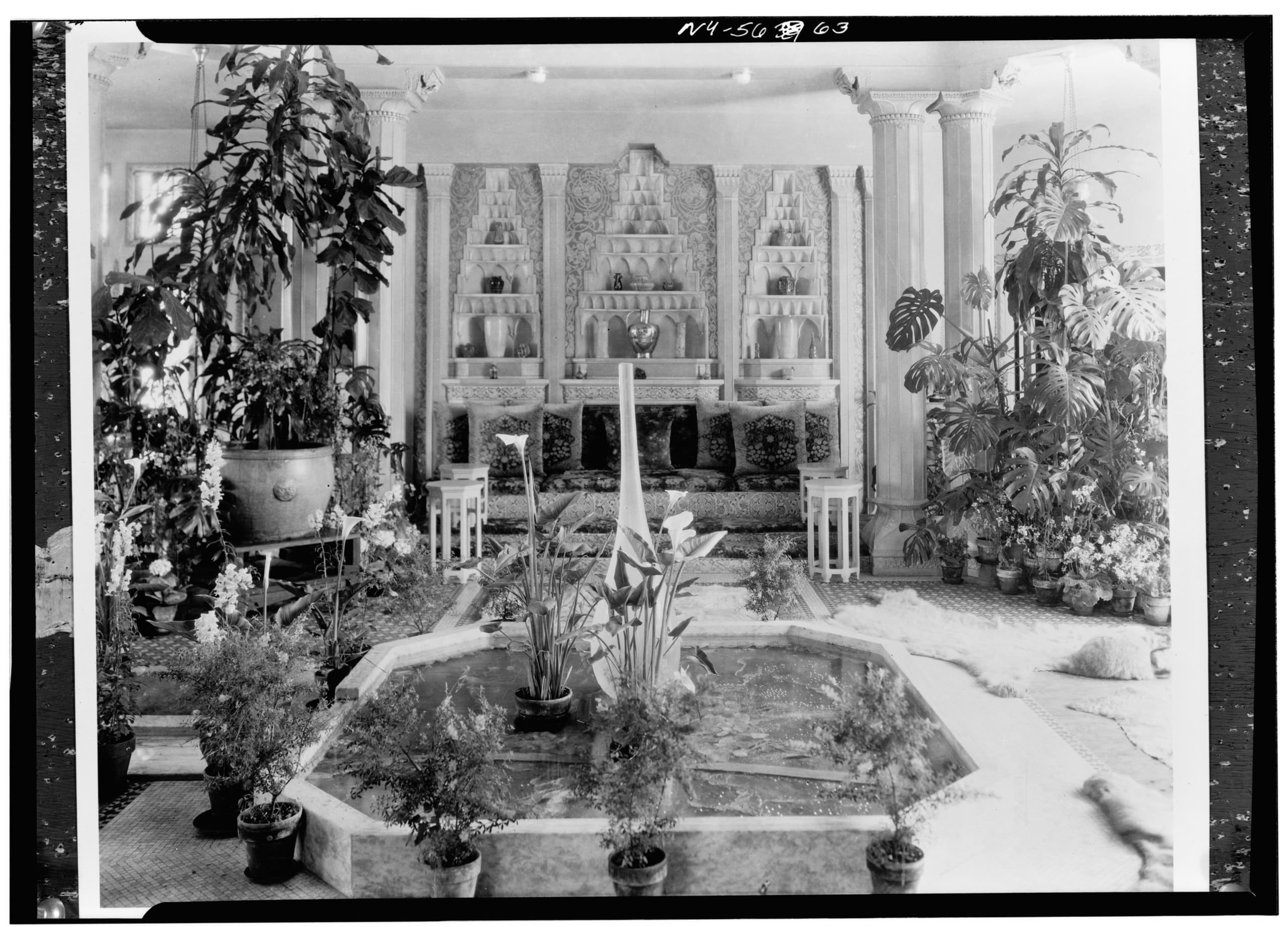 RIOT, NYC Creative Agency: The Central Court at Laurelton Hall, featuring a marble fountain, lush greenery, and Tiffany vases in architectural niches. Photo by David Aronow, via Wikimedia Commons. The Central Court at Laurelton Hall, featuring a marble fountain, lush greenery, and Tiffany vases in architectural niches. Photo by David Aronow, via Wikimedia Commons.