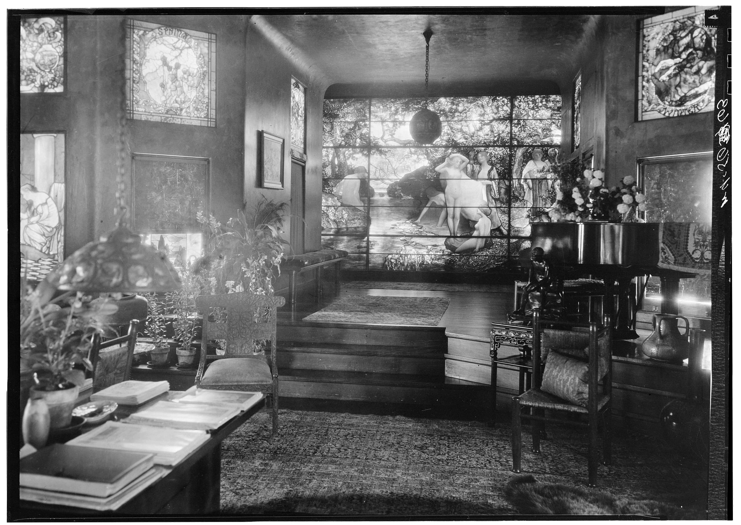 Interior of Laurelton Hall, showcasing Louis Comfort Tiffany’s stained glass masterpiece and artistic living space. Photo from the Historic American Buildings Survey, via Wikimedia Commons.