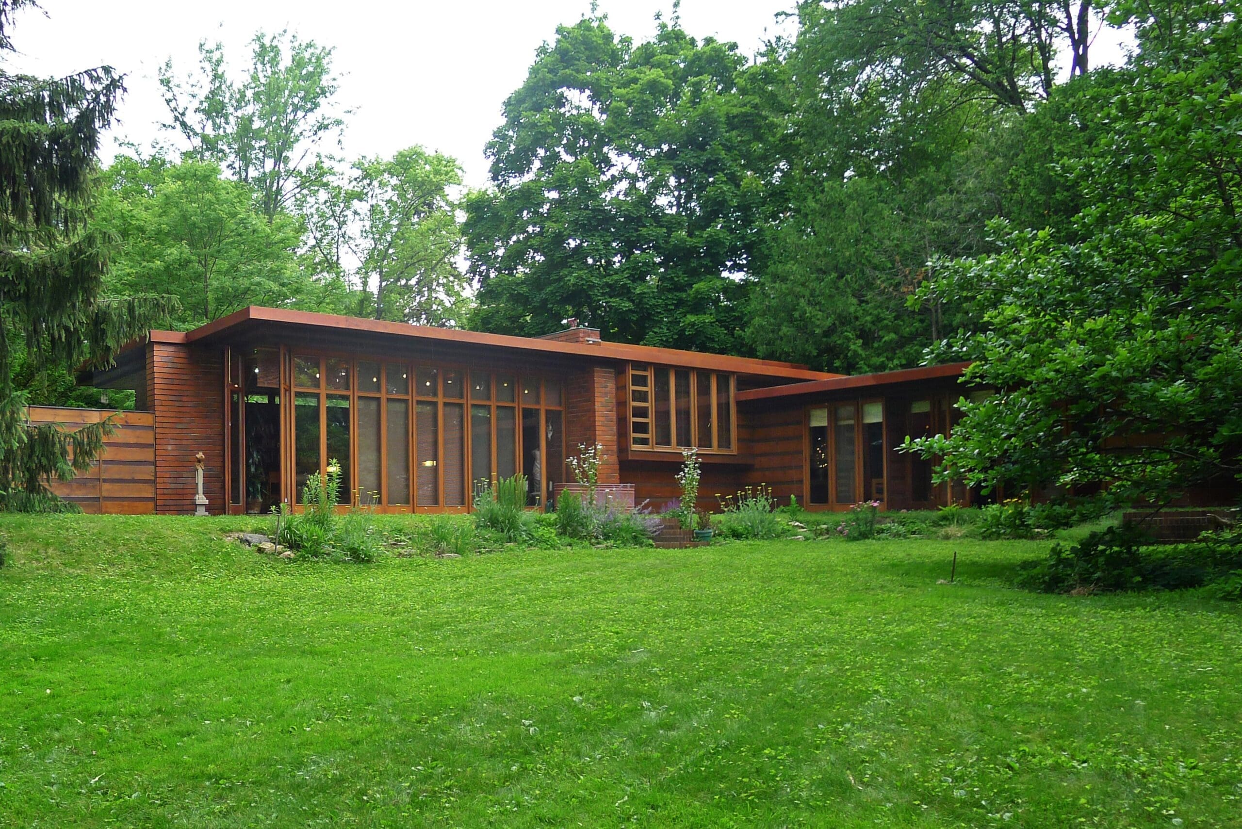 Jacobs First House, a Usonian house designed by Frank Lloyd Wright, showcasing its open layout and integration with the surrounding landscape.