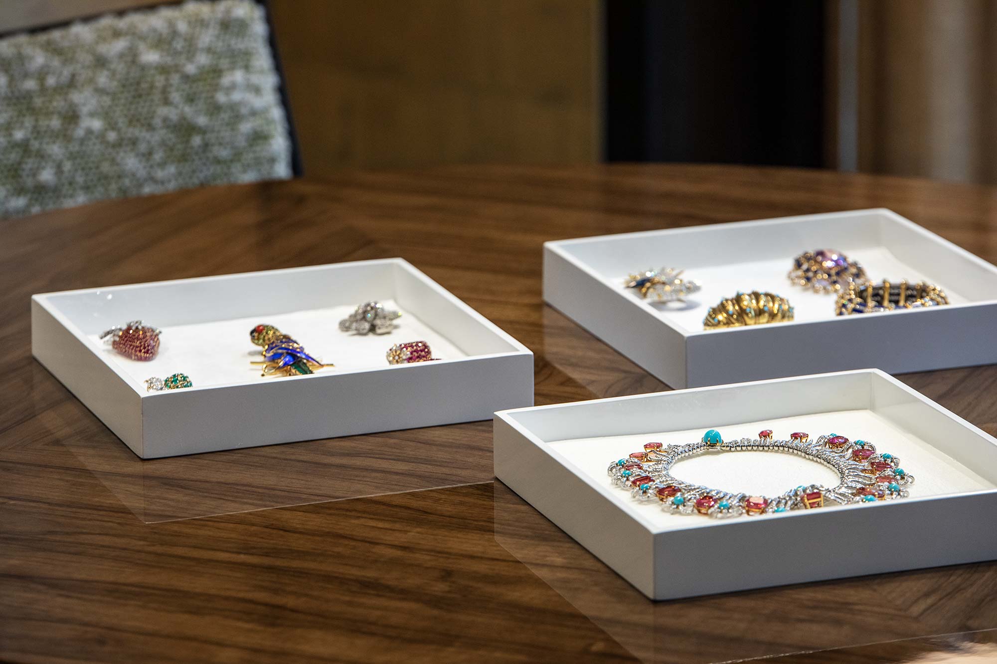 Jean Schlumberger jewelry collection of brooches and a necklace displayed in trays, photographed by Nick Hudson for RIOT & The Tiffany Archives