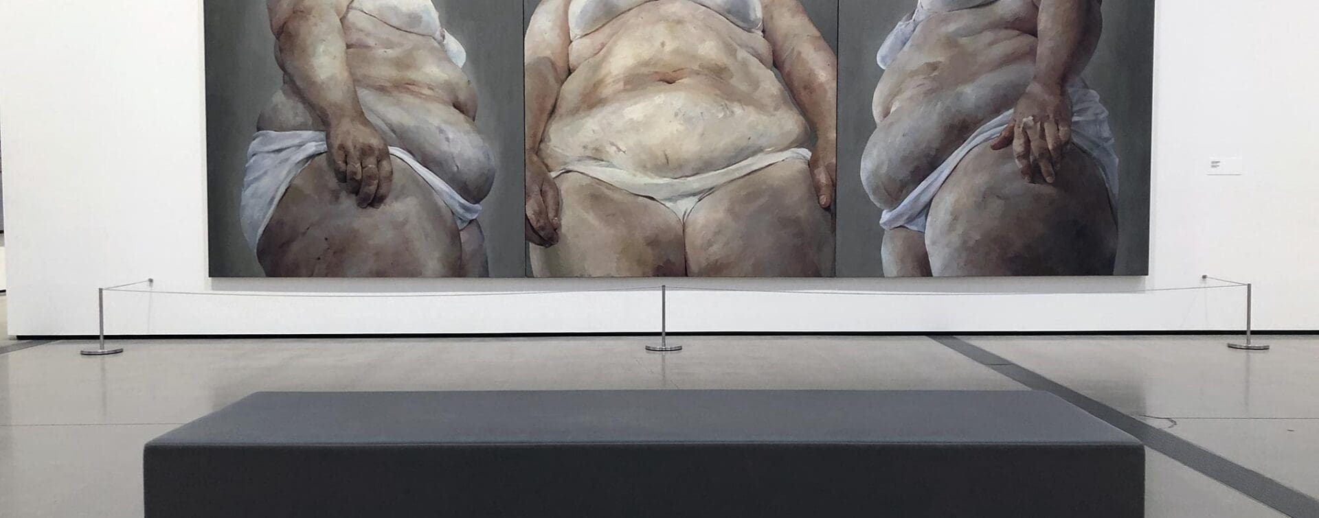 Jenny Saville’s triptych painting on display at The Broad museum, depicting fleshy, fragmented human forms