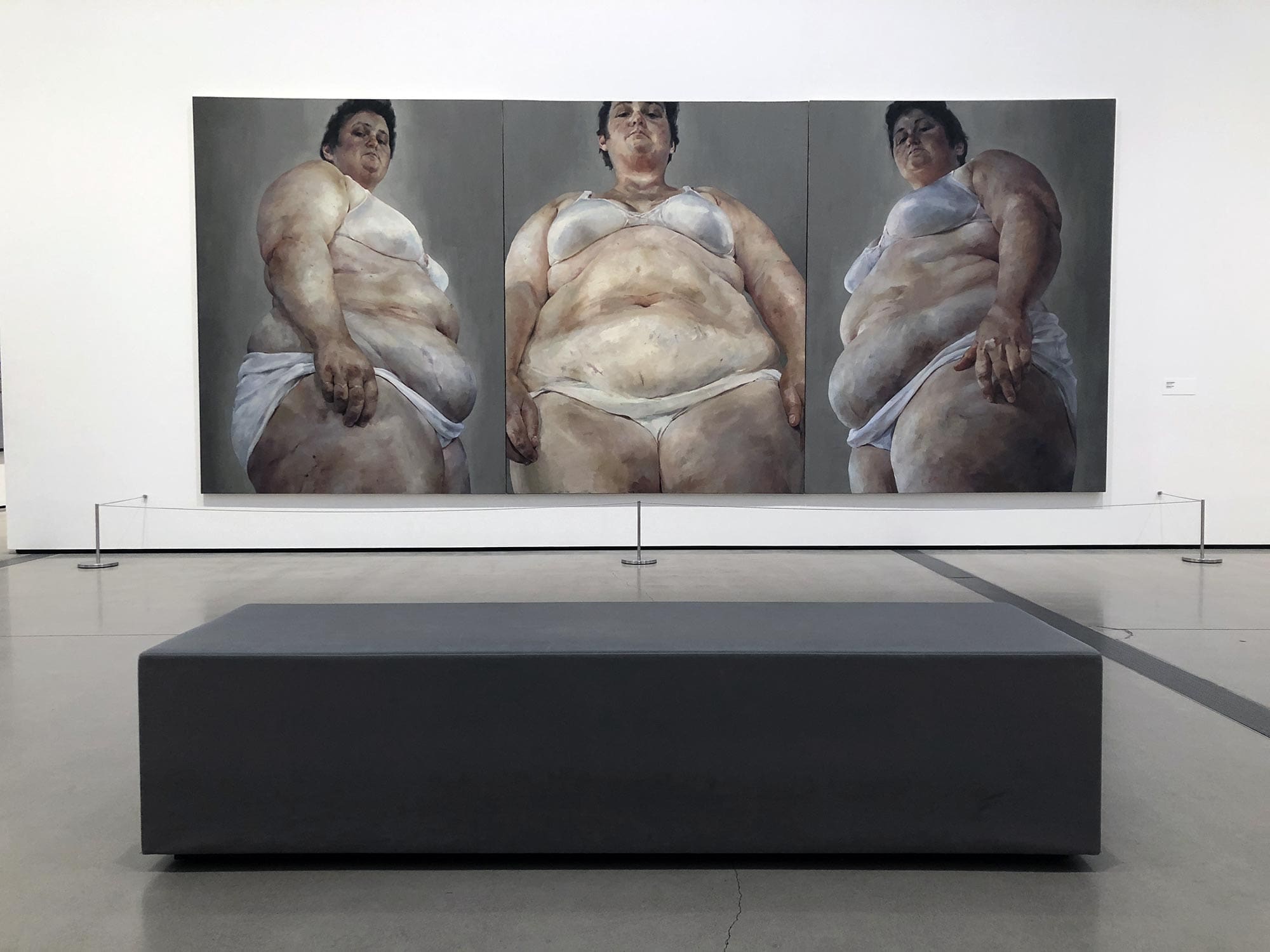 Jenny Saville’s triptych painting on display at The Broad museum, depicting fleshy, fragmented human forms