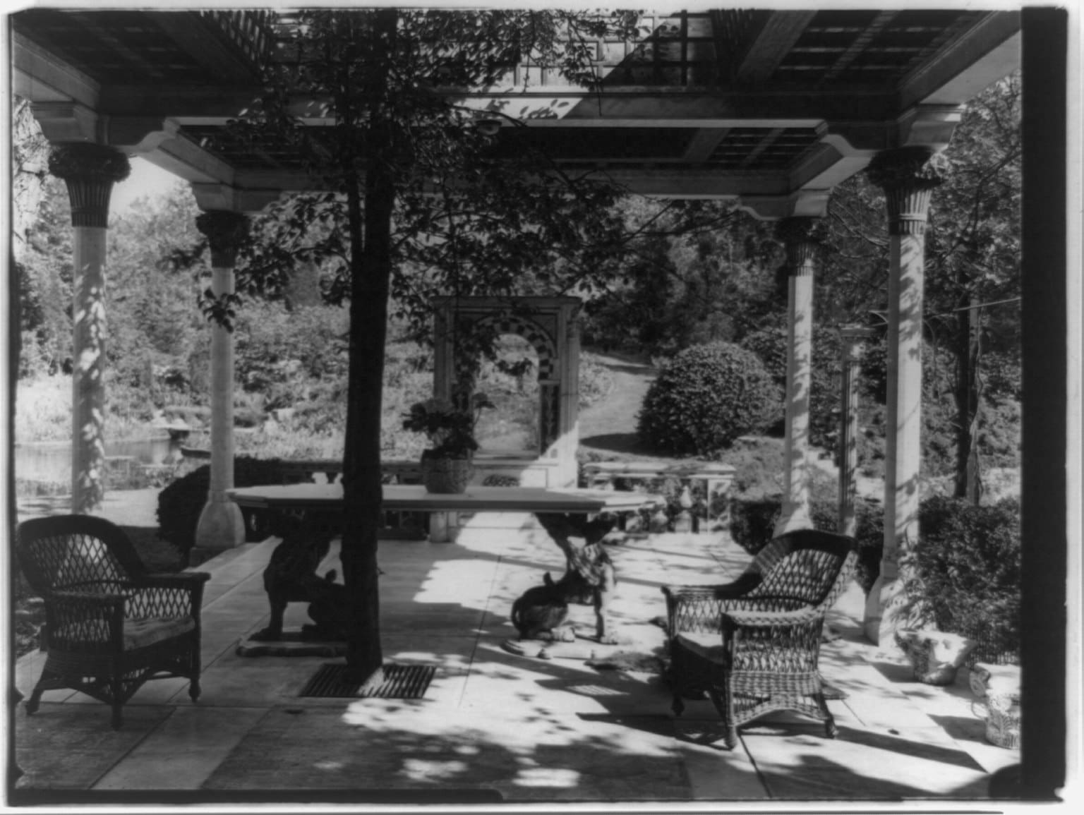 Loggia at Laurelton Hall, Louis Comfort Tiffany’s estate, featuring Moorish-inspired columns and lush gardens. Photo via Wikimedia Commons.