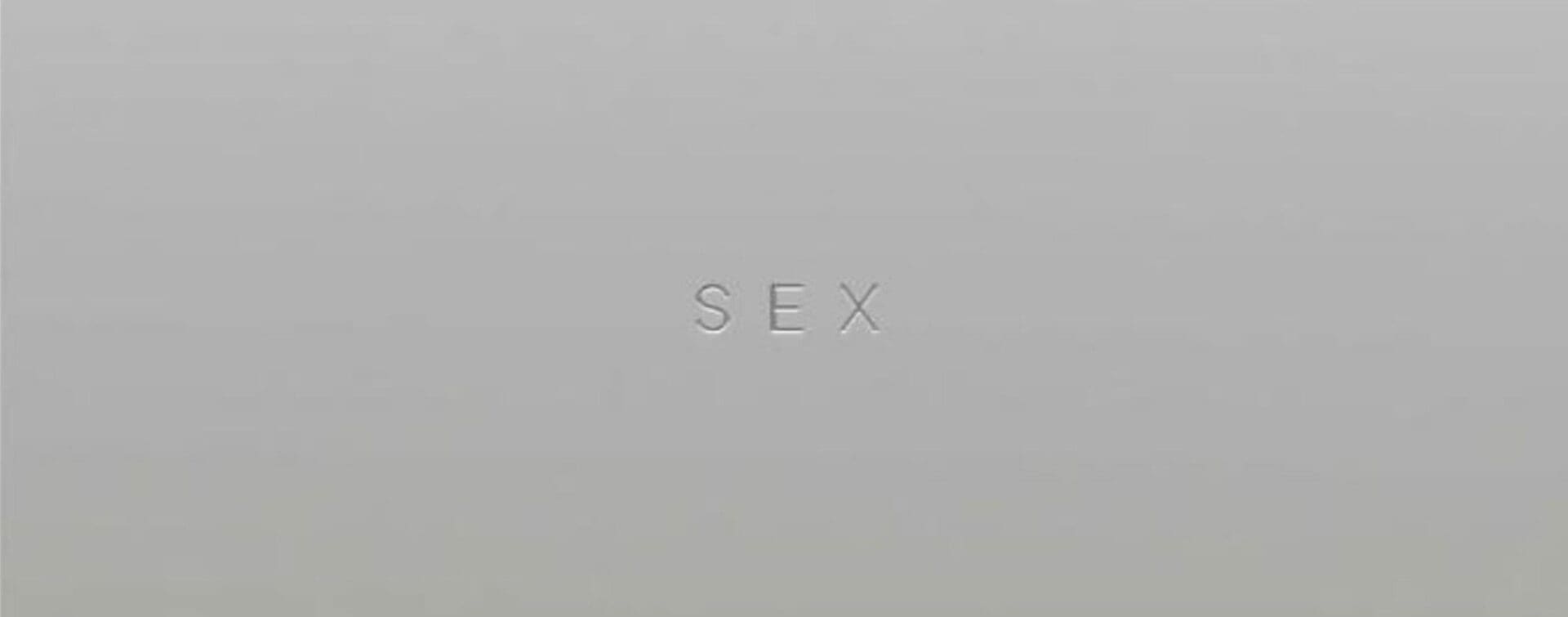 Minimalist metallic cover of Madonna’s 1992 Sex book with the word “SEX” embossed in the center.