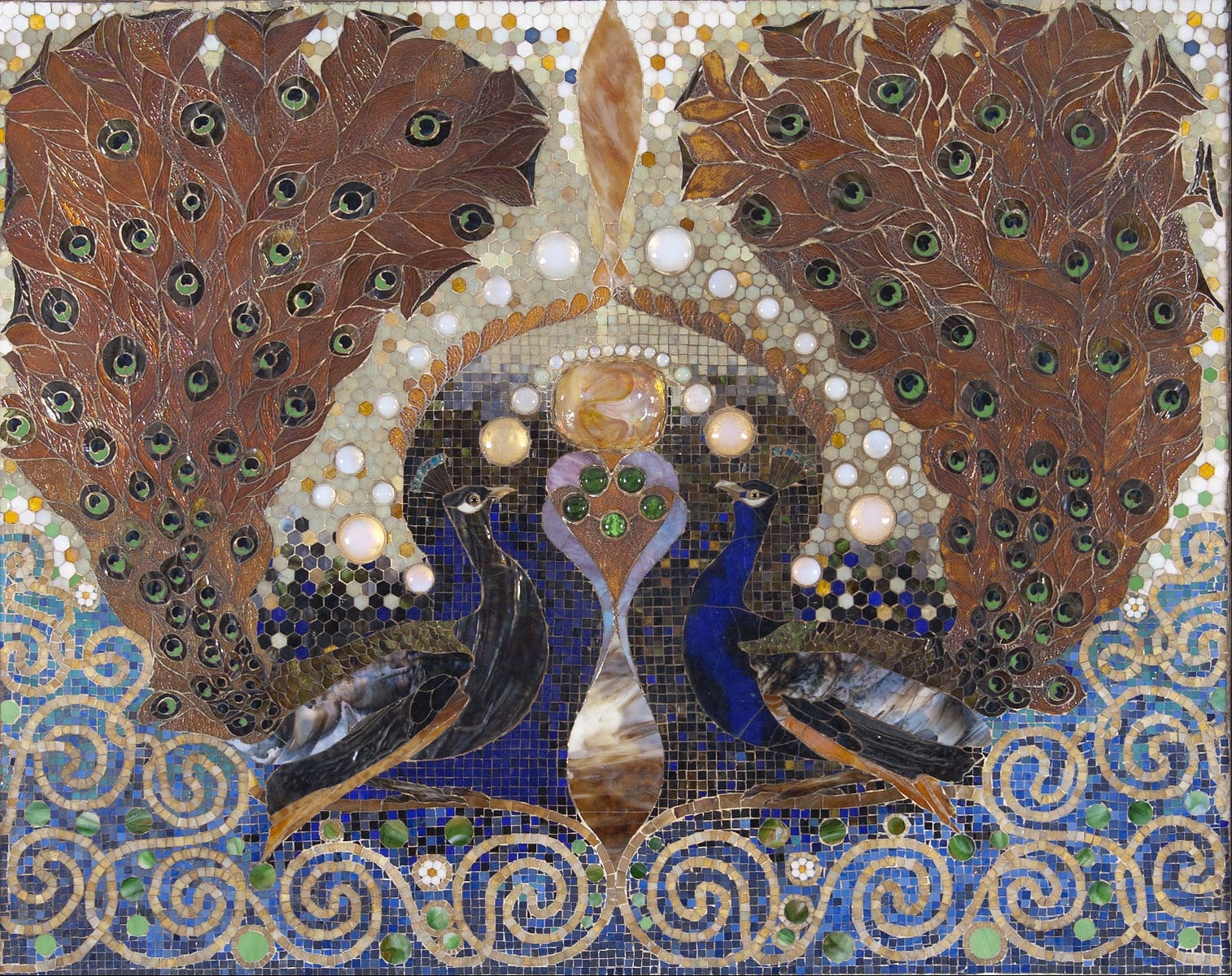 Peacock Mosaic by Louis Comfort Tiffany from the entrance hall of the Henry O. Havemeyer House, showcasing intricate glasswork and opulent design. Image via Wikimedia Commons.