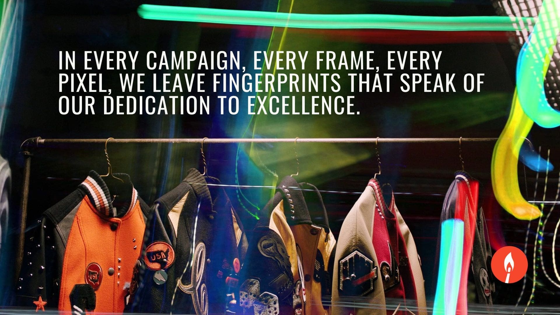 RIOT, NYC Creative Agency: A vibrant image showcasing a row of colorful jackets on a clothing rack, with the text 'In every campaign, every frame, every pixel, we leave fingerprints that speak of our dedication to excellence.' The RIOT logo is displayed below the text. A vibrant image showcasing a row of colorful jackets on a clothing rack, with the text 'In every campaign, every frame, every pixel, we leave fingerprints that speak of our dedication to excellence.' The RIOT logo is displayed below the text.