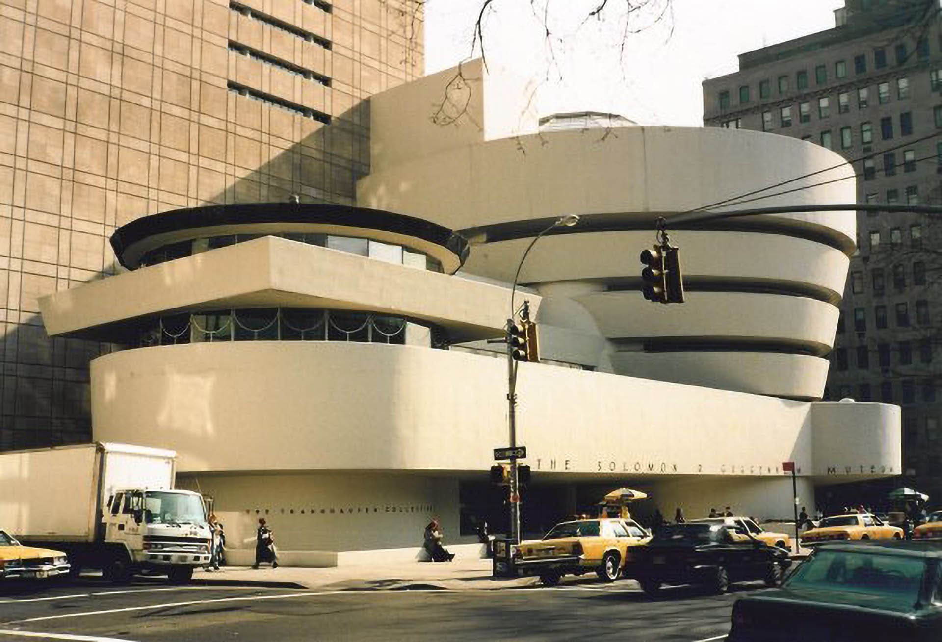 The exterior of the Solomon R. Guggenheim Museum in New York City, designed by Frank Lloyd Wright, showcasing its unique circular structure in a 1995 photograph.