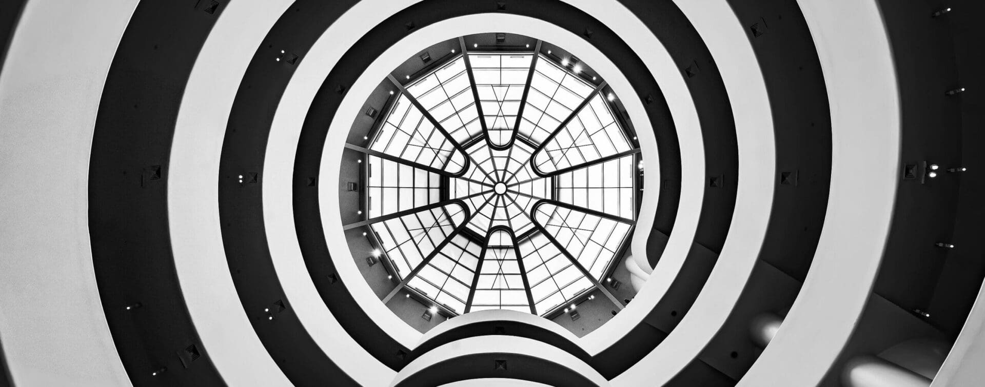 The skylight of the Solomon R. Guggenheim Museum in New York, designed by Frank Lloyd Wright, featuring concentric circular designs viewed from below.