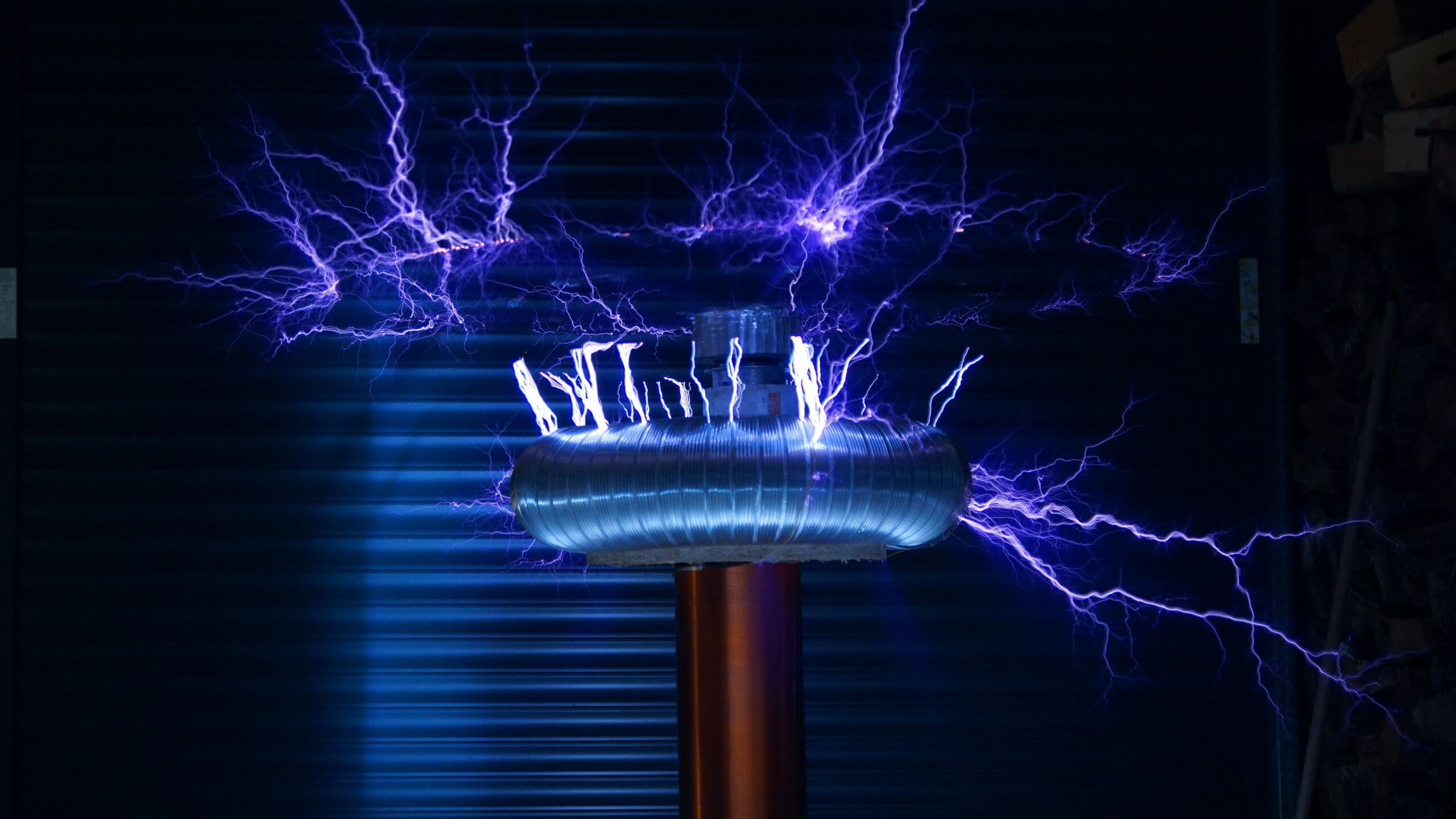 A Tesla Coil emitting electrical arcs, captured using long-exposure photography.
