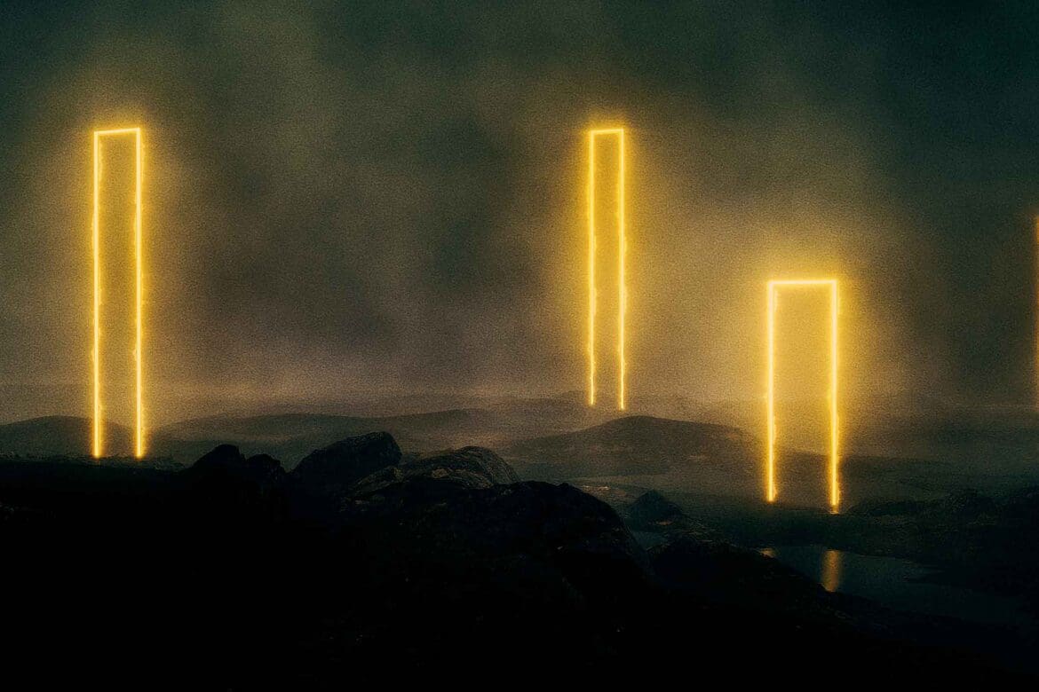 Tall glowing golden monoliths standing in a dark misty landscape from Bleed Electric’s This Is My Masterpiece music video