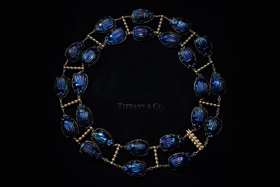 Close-up of an archival Tiffany scarab necklace on black velvet, captured for Tiffany x Frankenstein by RIOT.