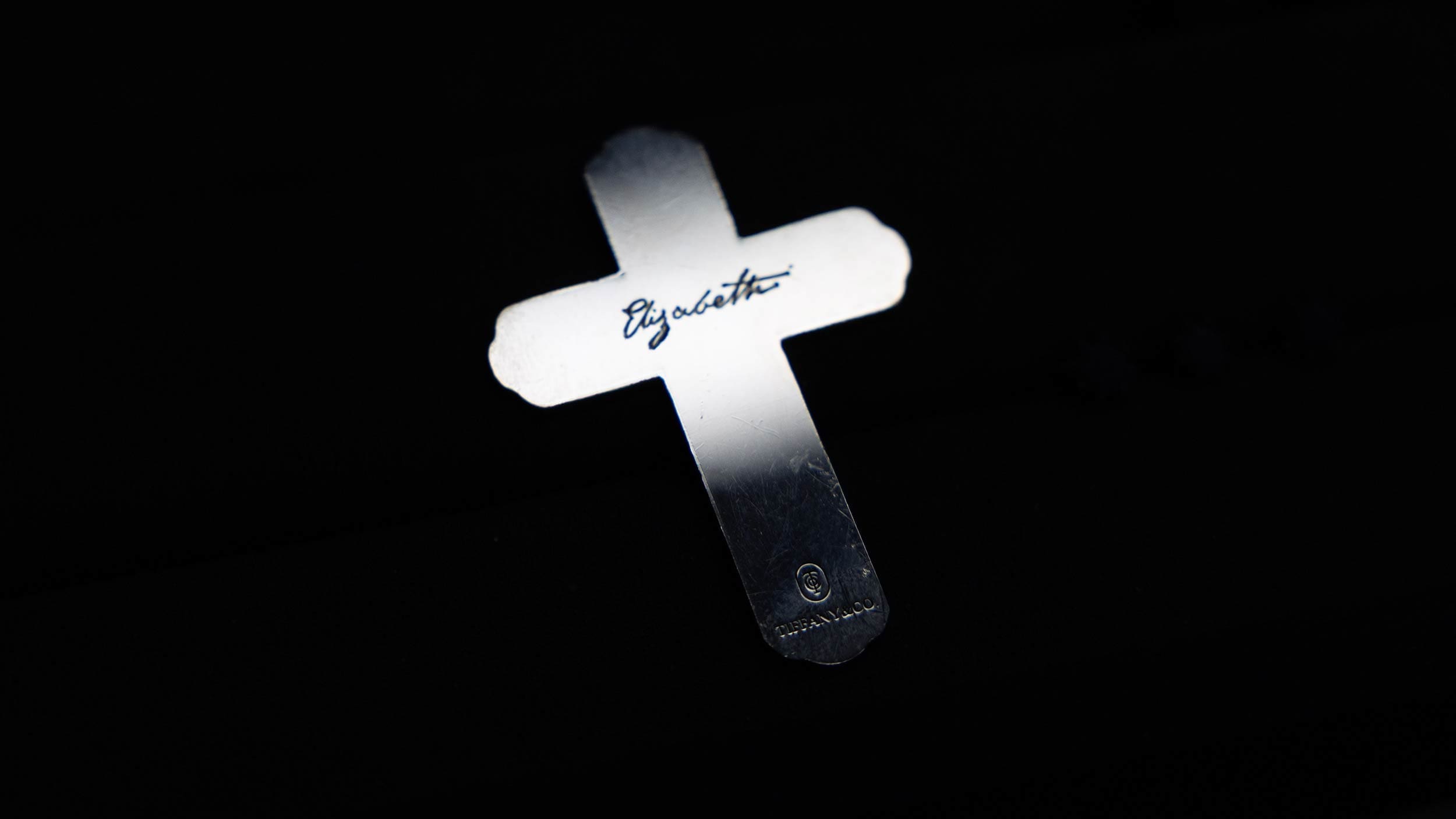 RIOT, NYC Creative Agency: Close-up of Tiffany & Co.’s silver cross engraved with “Elizabeth,” created for Guillermo del Toro’s Frankenstein and photographed by RIOT. Close-up of Tiffany & Co.’s silver cross engraved with “Elizabeth,” created for Guillermo del Toro’s Frankenstein and photographed by RIOT.