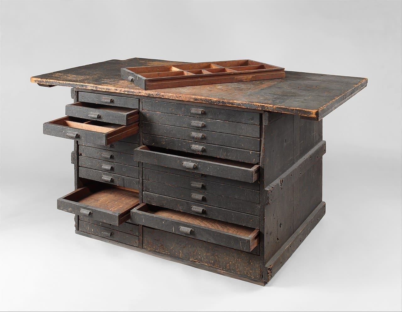 RIOT, NYC Creative Agency: Wooden work bench from Tiffany Studios, featuring multiple drawers and compartments, from the Metropolitan Museum of Art. Image via Wikimedia Commons. Wooden work bench from Tiffany Studios, featuring multiple drawers and compartments, from the Metropolitan Museum of Art. Image via Wikimedia Commons.