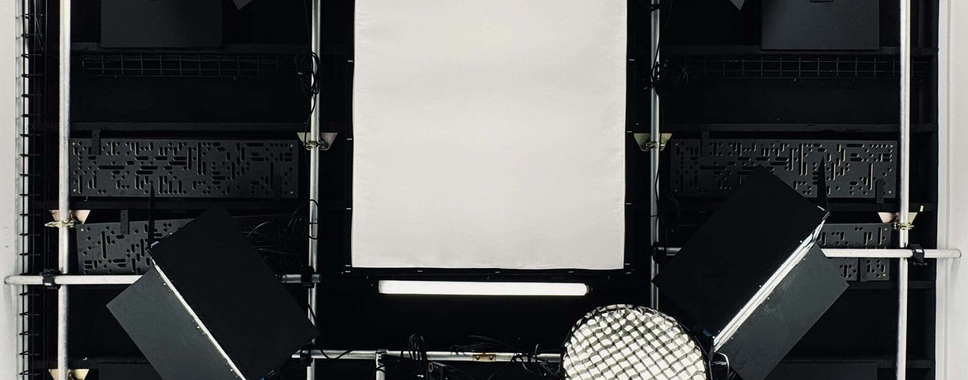 View of the lighting grid improvements at RIOT’s Grove Street Studio, taken from the floor looking up at the ceiling.